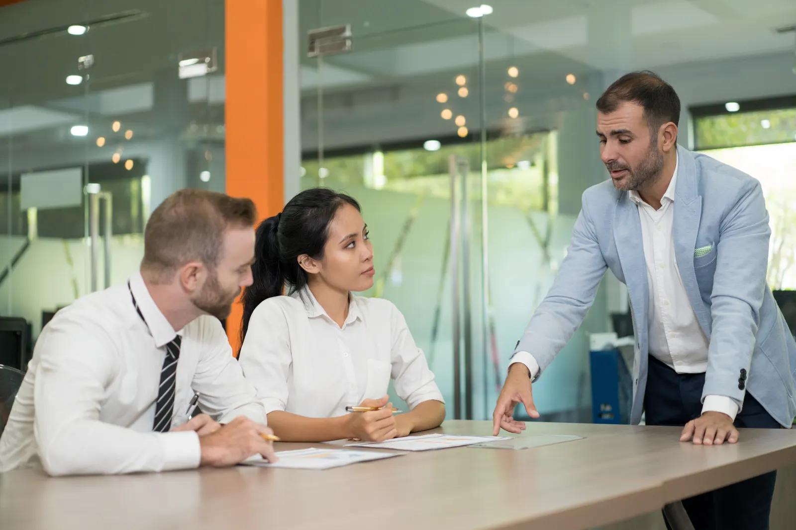 Directors reviewing sustainability disclosures at a boardroom table