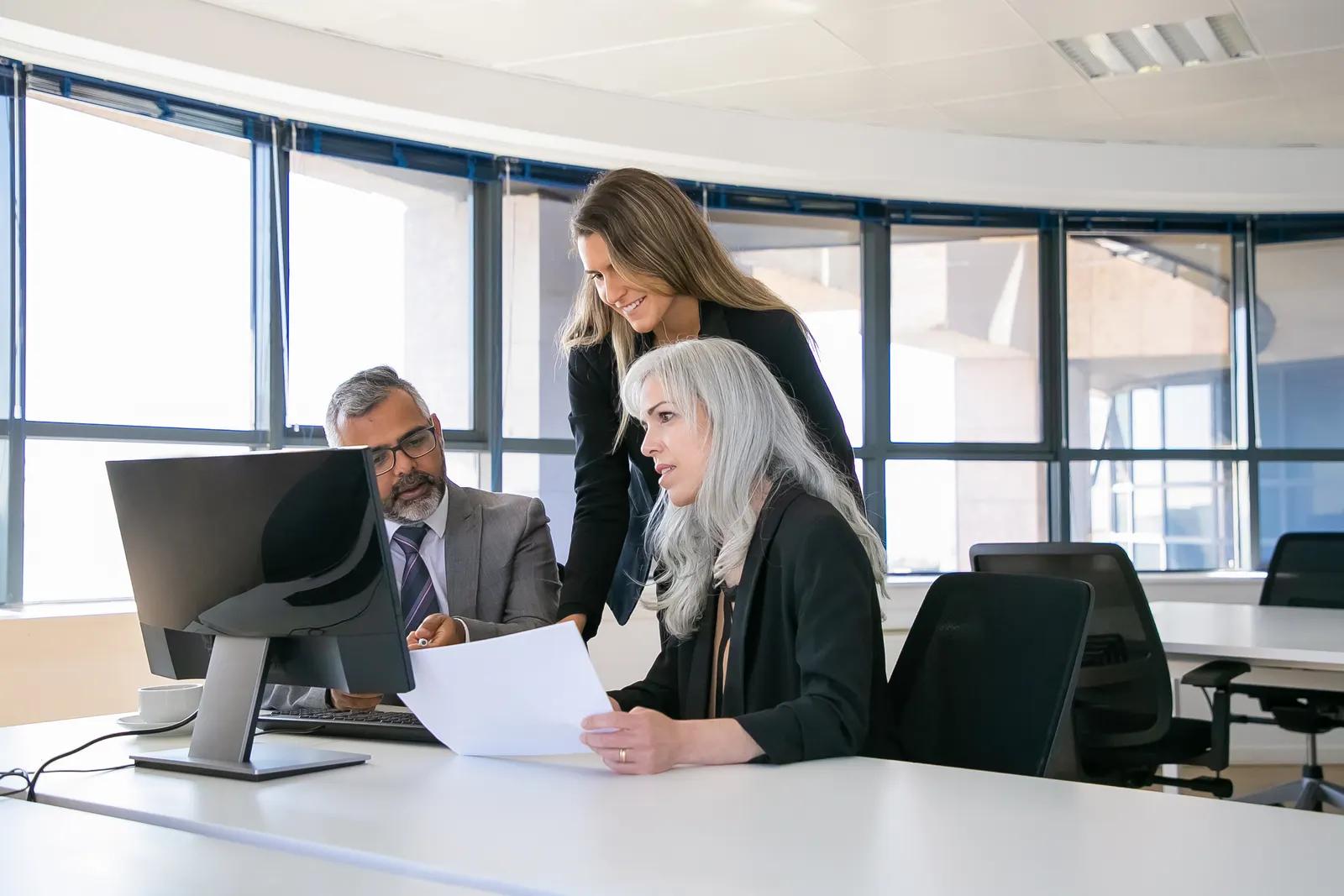 A team of executives reviewing performance data
